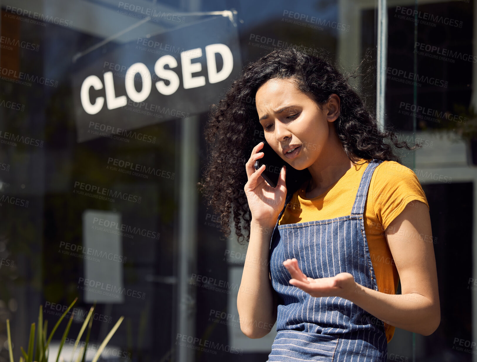 Buy stock photo Woman, closed business and sign in window with phone call, stress and bankruptcy with cafe closing. Contact, fail and problem, female owner of restaurant with financial crisis and communication