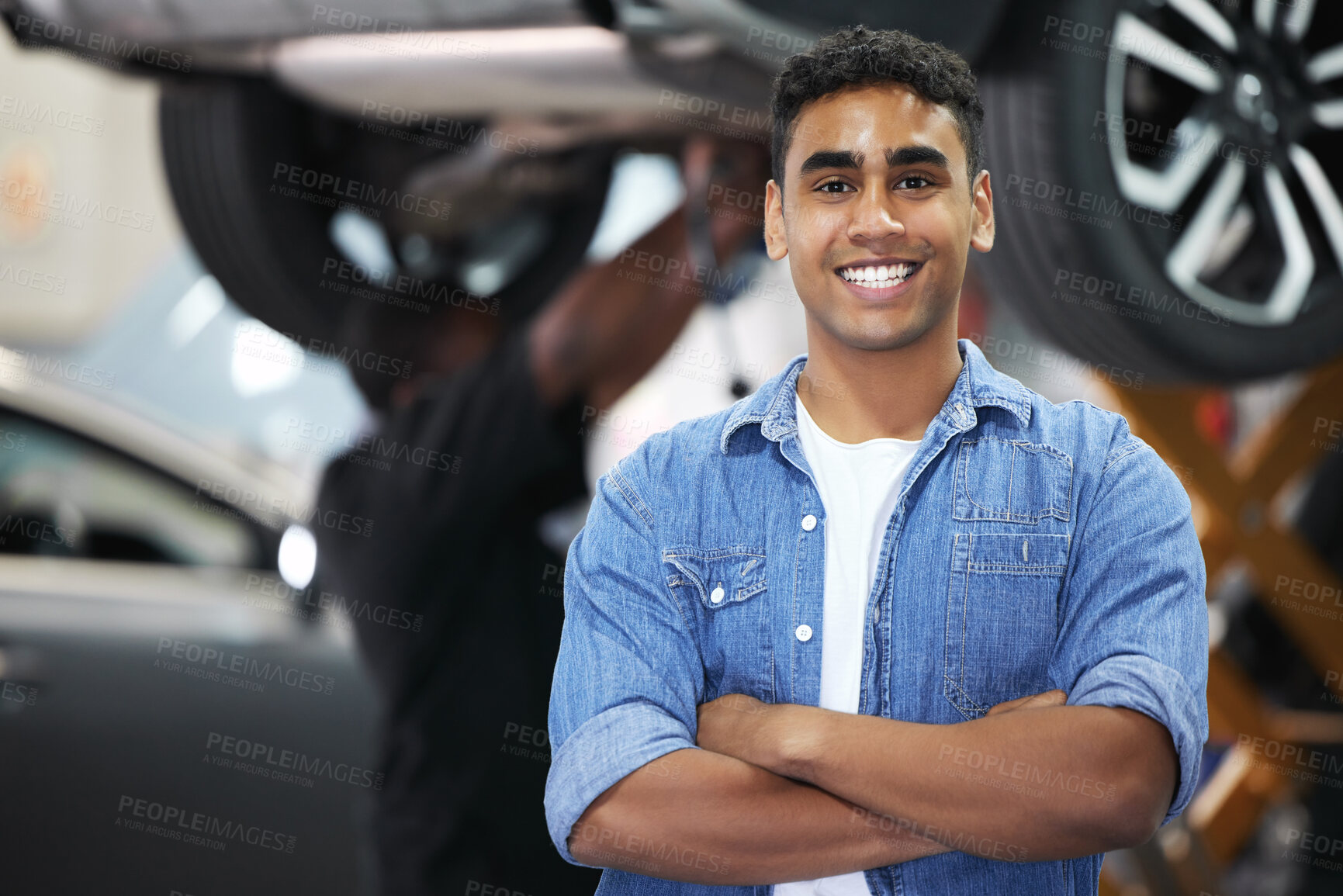 Buy stock photo Portrait, man and smile as mechanic in automobile, workshop and repairs with confident or pride as engineer. Male person, worker and automotive in industry as maintenance, service and expert for cars