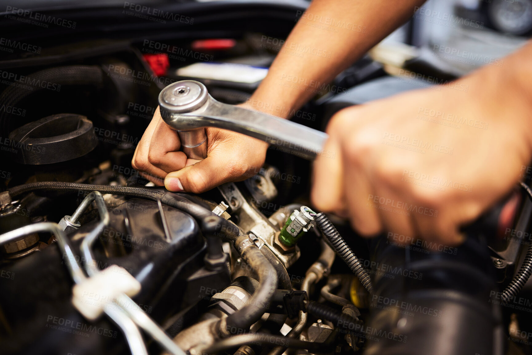 Buy stock photo Person, hands and mechanic with spanner for fixing engine and motor maintenance in workshop. Industry, engineer and  vehicle repairs with oil change in routine car checkup and service in garage