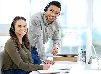 Buy stock photo Call center, man coaching woman and smile in portrait, office and writing notes for learning at telemarketing job. Crm, teaching and notebook for customer service, consulting and tech support with pc