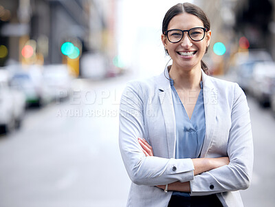 Buy stock photo Shot of a young businesswoman standing in the street