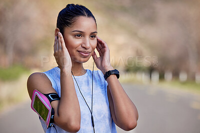 Buy stock photo Music, outdoor fitness and woman listening to wellness podcast, exercise audio and workout or training. Radio, listen and young runner, sports person or athlete, exercise motivation and street