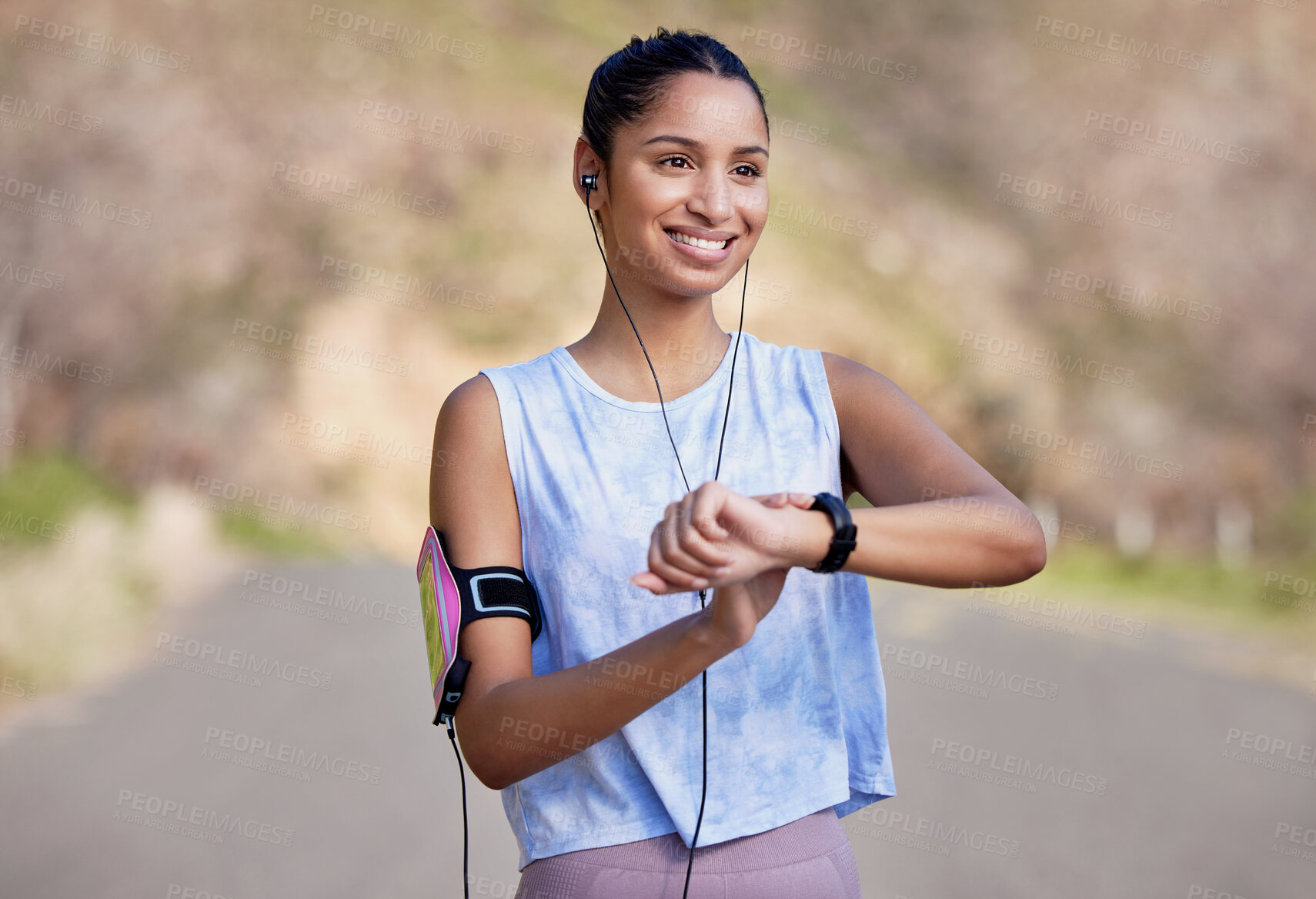 Buy stock photo Fitness, smartwatch and woman on a break from running in the road for race or marathon training. Sports, workout and female athlete checking the time for her outdoor cardio exercise in the street.