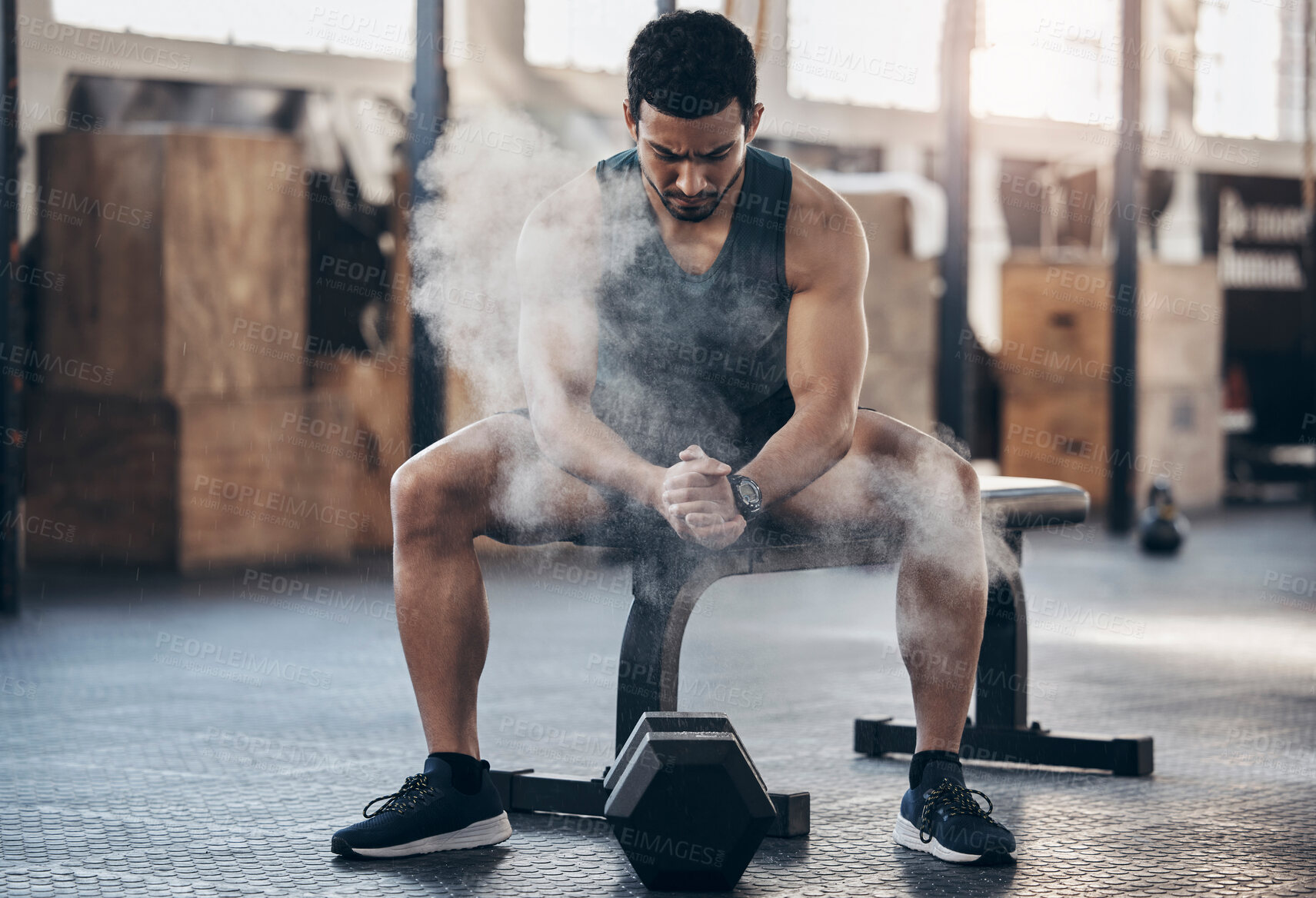 Buy stock photo Dumbbell, chalk powder and man in gym, fitness and exercise with challenge, strong and healthy. Person, athlete and guy in wellness center, dust and equipment with training, strength and workout
