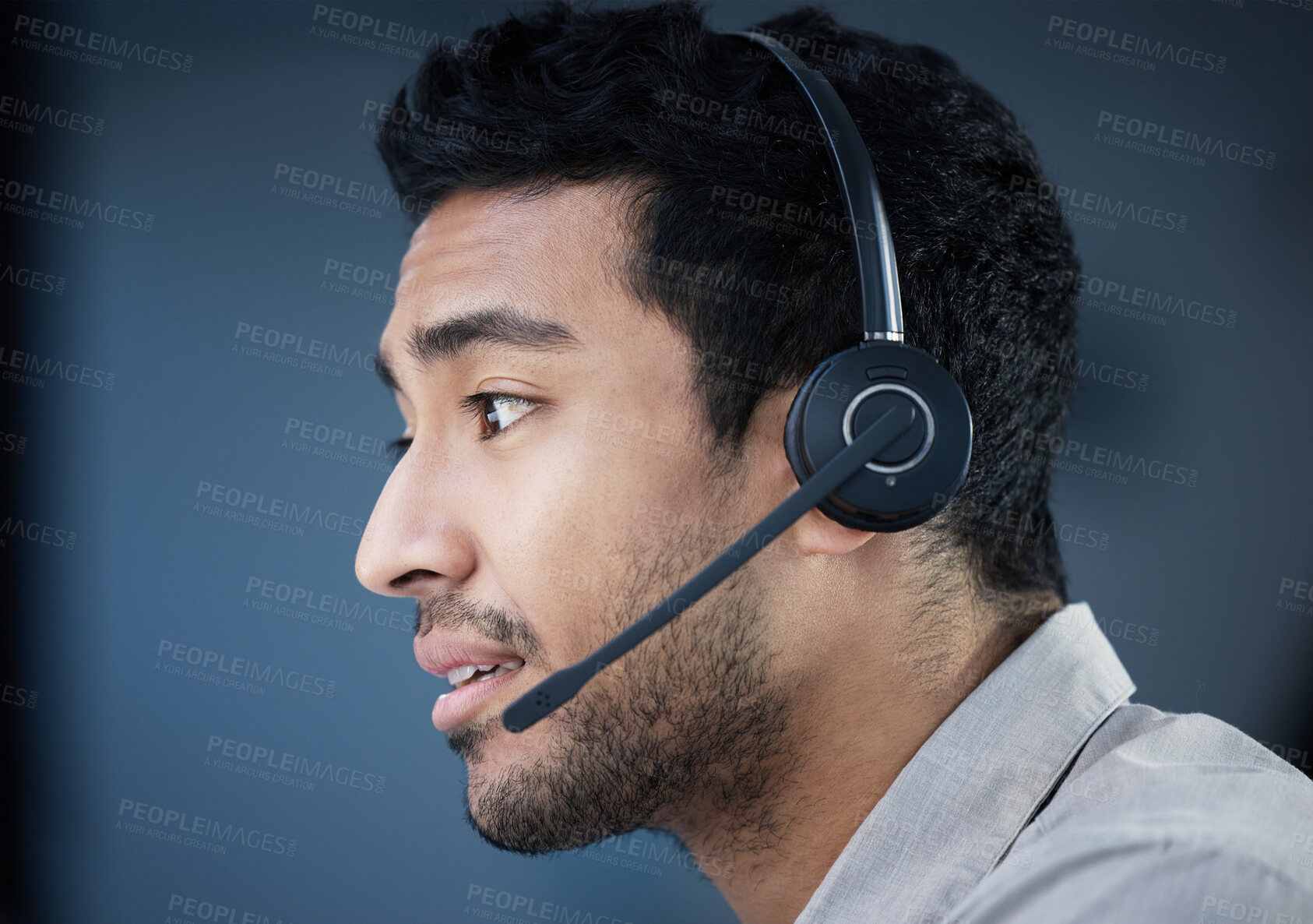 Buy stock photo Call center, face and headset with Indian man in telemarketing office for customer support. Consulting, contact us and sales service with confident crm agent in workplace for telecommunications