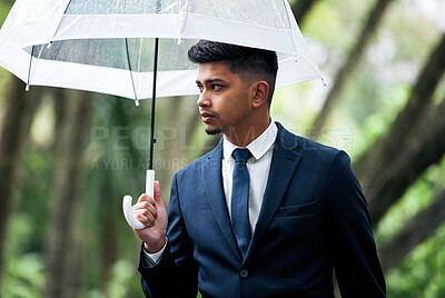 Buy stock photo Business, man and walking with umbrella in rain, outside and financial insurance for safety or security. Assurance, accountability and protection or cover for assets, future and investment for work
