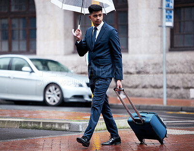 Buy stock photo Business, man in city with umbrella or outside, luggage and travel insurance or thinking for urban trip for job. Commute, walking and safety investment for cover, accountability and suitcase