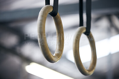 Buy stock photo Gymnastic rings, gym and workout for aerobics, fitness and strong or power challenge for training. Equipment, tool and flexibility exercise or sports for wellness, arena and gear for competition