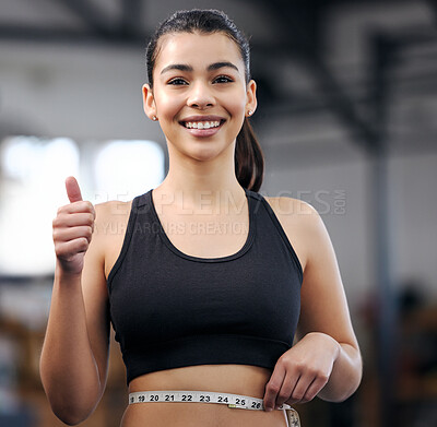 Buy stock photo Portrait, weight loss and thumbs up with smile, girl and measuring tape for fitness in gym and training. Promotion, yes and promote for club, exercise and achievement for body and sportswear