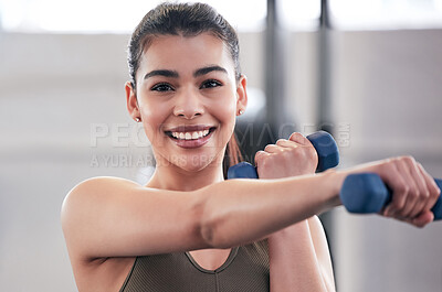 Buy stock photo Woman, portrait and dumbbell in gym for fitness, exercise and training for strong arm muscle. Person, bodybuilder and athlete for sport and power, action and equipment for workout or weightlifting