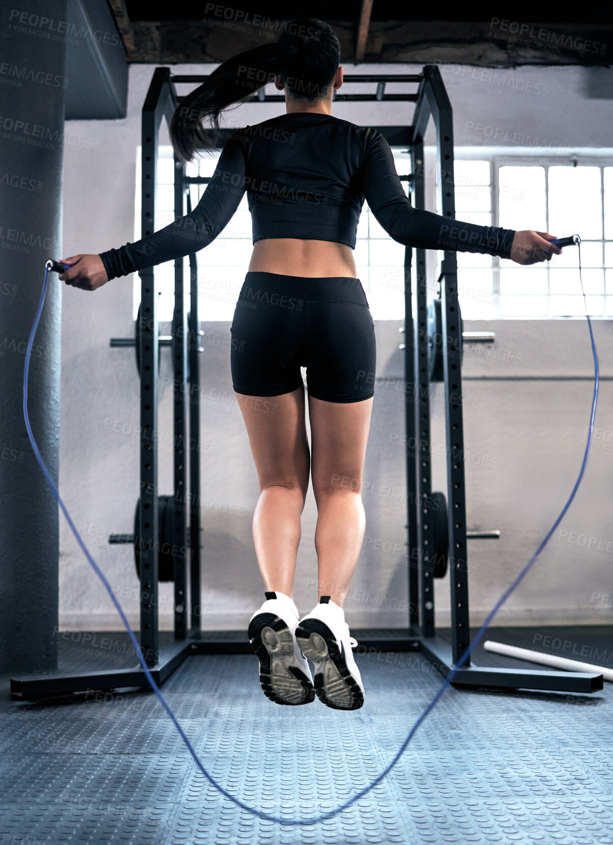 Buy stock photo Woman, skipping and gym for cardio fitness, endurance and exercise in wellness. Workout, sport or weight loss for training and baby or jump rope for performance, female athlete or body health