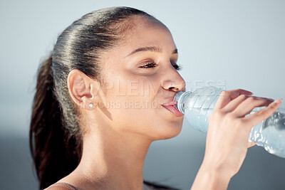 Buy stock photo Woman, fitness and drinking water with bottle for hydration, recovery or natural sustainability. Face of young female person, runner or athlete on break with mineral liquid for thirst after workout