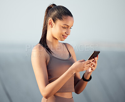 Buy stock photo Outdoor, exercise and woman with smartphone, typing and social media with fitness, check progress and healthy. Athlete, happy person or runner with cellphone, digital app and network with wellness