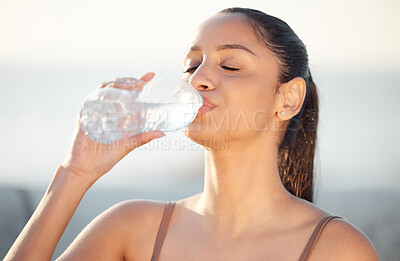 Buy stock photo Woman, athlete and drinking water outdoors, thirsty and runner hydration after workout or cardio. Female person, detox and mineral liquid for recovery after exercise, fitness sports and nutrition