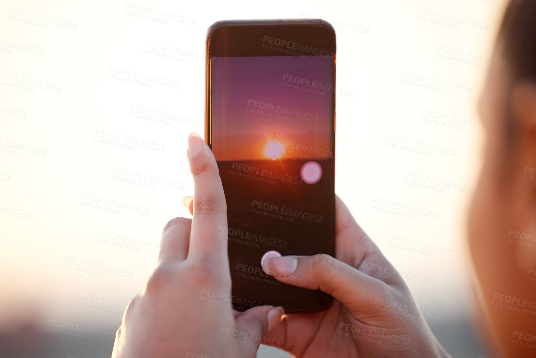 Buy stock photo Sunset, phone and hands of woman, screen and post on social media with sky, clouds or sunlight. Cellphone, photo and female person with tech for memory of vacation, holiday or scenic view