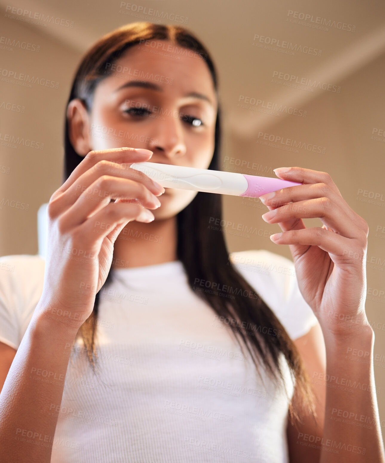 Buy stock photo Anxiety, woman and hands with pregnancy test in home for results, scared or nervous for ivf fail. Maternity, stress and serious person waiting with worry, fear and frustrated for mistake in low angle