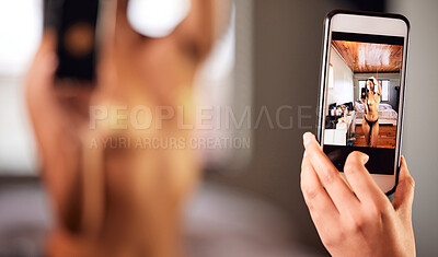 Buy stock photo Shot of a young woman taking a topless selfie