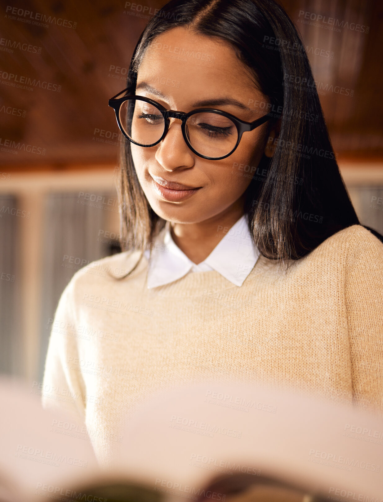Buy stock photo College student, studying and girl with textbook in home for university, research or school education. Learning course, glasses and Indian woman reading novel for academic information or knowledge