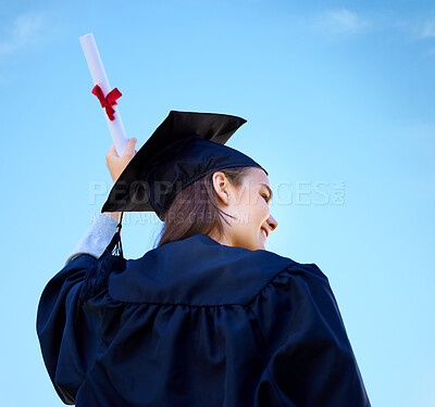 Buy stock photo Woman, student and diploma at outdoor graduation, blue sky and proud of education celebration. Female person, back and degree at college or university for achievement, graduate and learning award