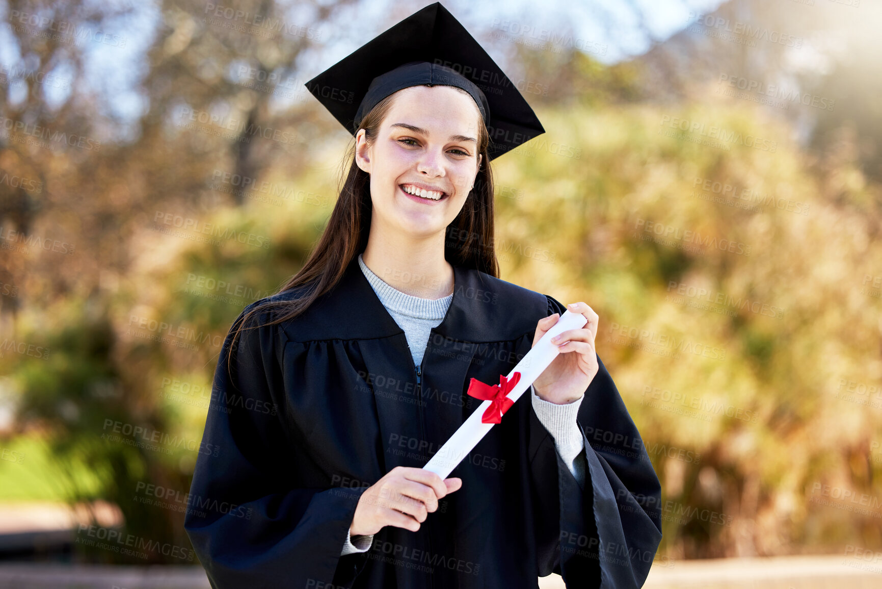 Buy stock photo Woman, portrait and diploma at graduation ceremony, celebration and proud of education in outdoor. Female person, confident and degree at college or university for achievement,, graduate and learning