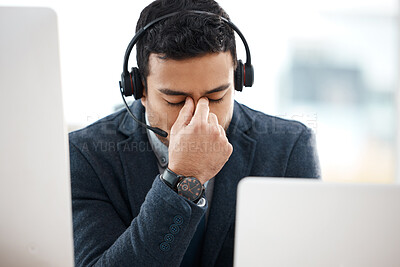 Buy stock photo Headache, call center and business man with fatigue, stress and anxiety in a office with deadline. Contact us, telemarketing and phone consultation work of a worker with eye strain feeling tired