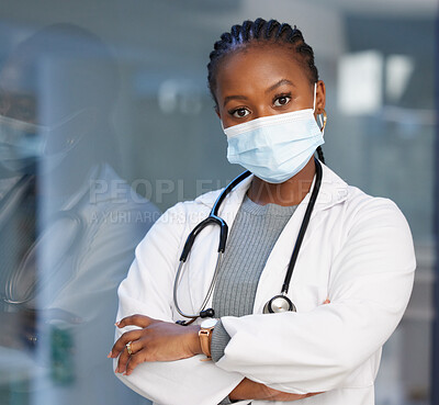 Buy stock photo Portrait, virus and arms crossed with a doctor black woman in the hospital wearing a mask for safety. Medical, healthcare and insurance with a female medicine professional you can trust in a clinic