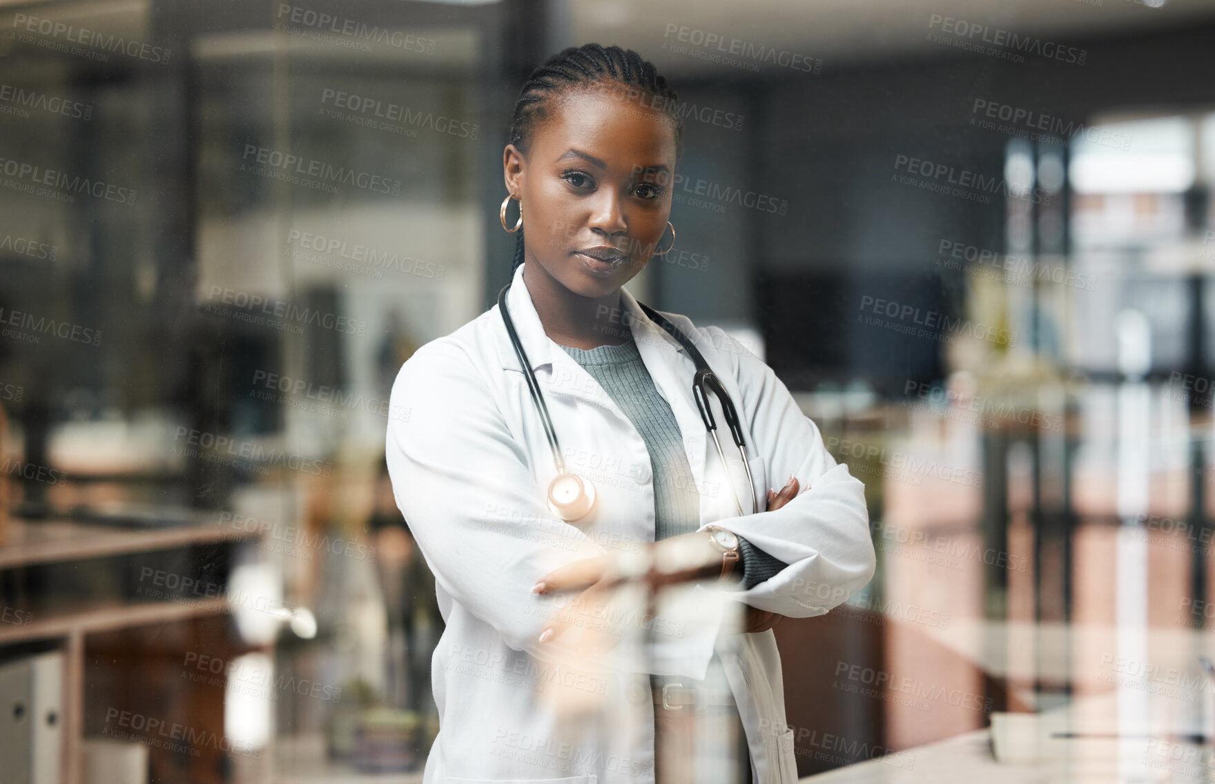Buy stock photo Black woman, doctor and confidence in office for medical with stethoscope, portrait of professional in healthcare. Female person, medicine and arms crossed at job, consulting at hospital for wellness