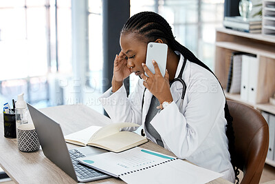 Buy stock photo Hospital, doctor and black woman with stress on a phone call for conversation, talking and discussion. Healthcare, burnout and female worker on smartphone for medical service, consulting and help