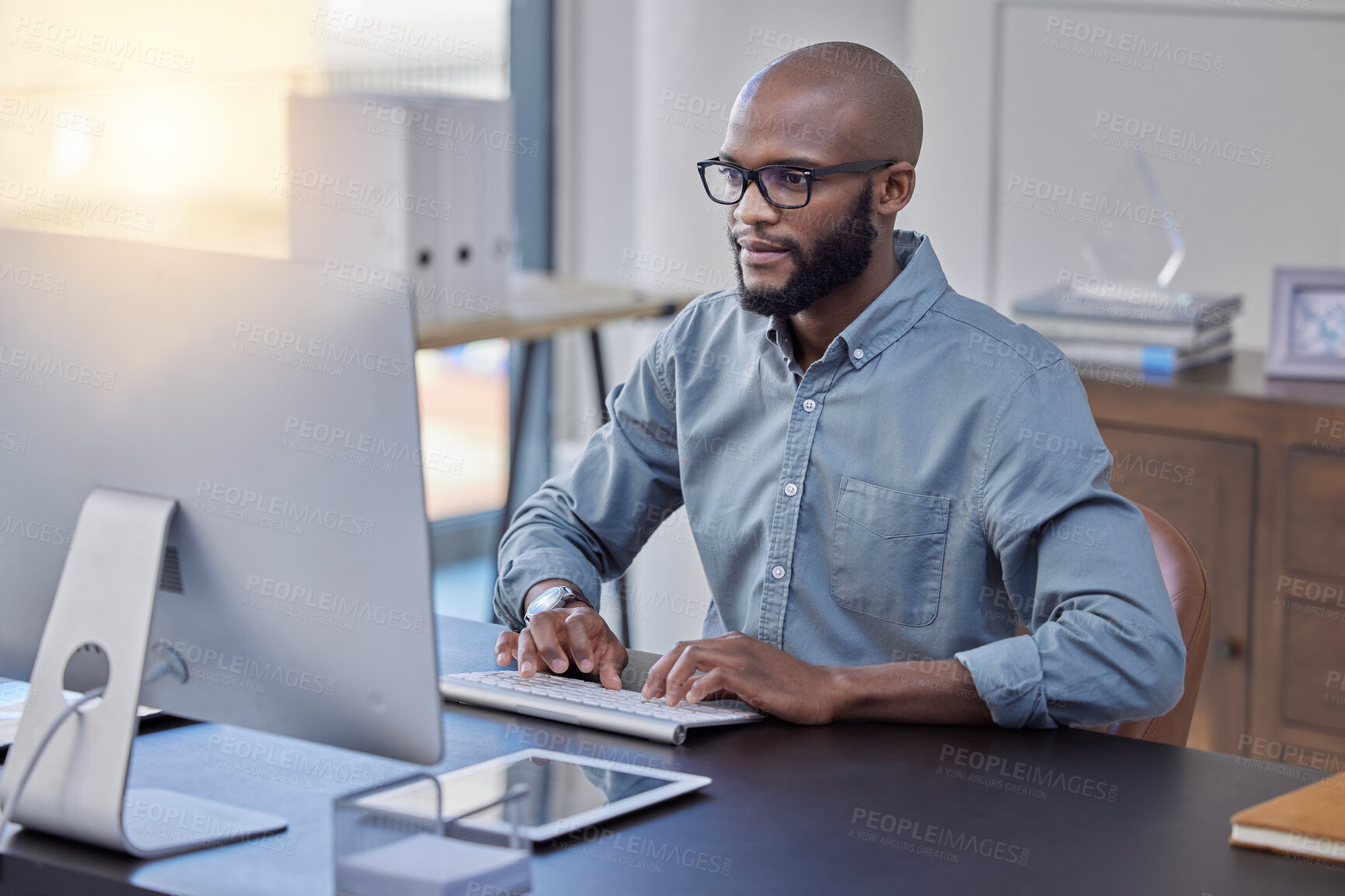 Buy stock photo Programmer, computer and black man typing for software, coding or email in office. IT, desktop and African professional working on cyber security, business code or internet research for programming.