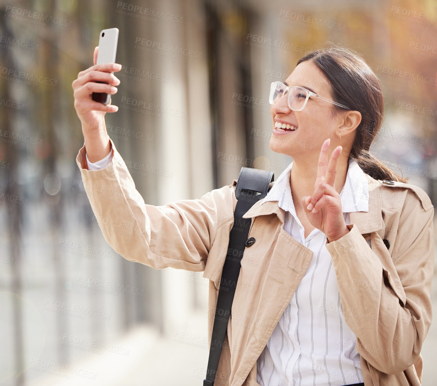 Buy stock photo Business woman, selfie and peace sign in city with smile for profile picture, photography and post on web. Person, happy and live streaming with icon, symbol and app on metro street with social media