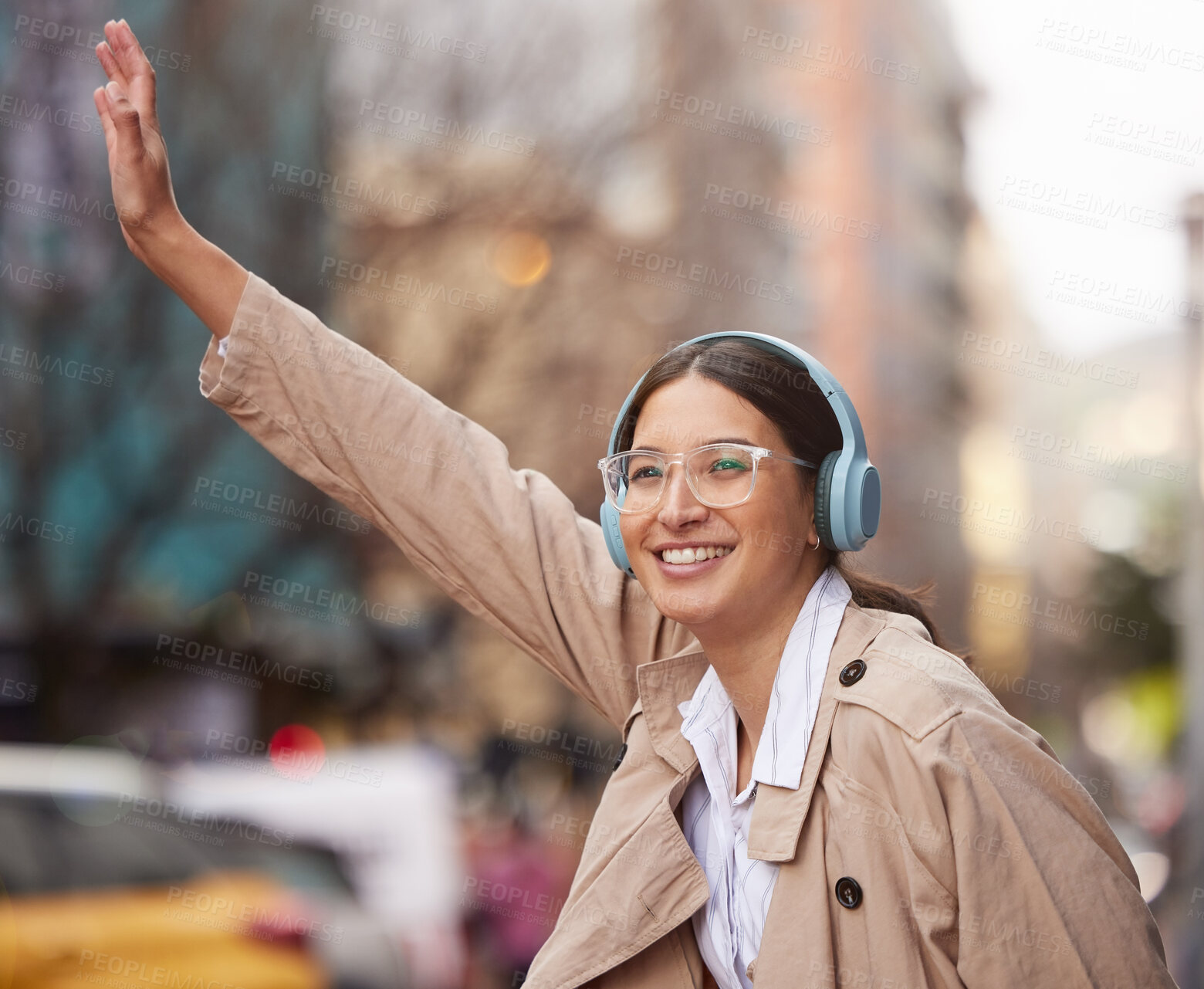 Buy stock photo Business woman, headphones and street for taxi, travel or smile with audio streaming subscription. Person, wave and happy in city with waiting for transportation on commute to workplace in New York