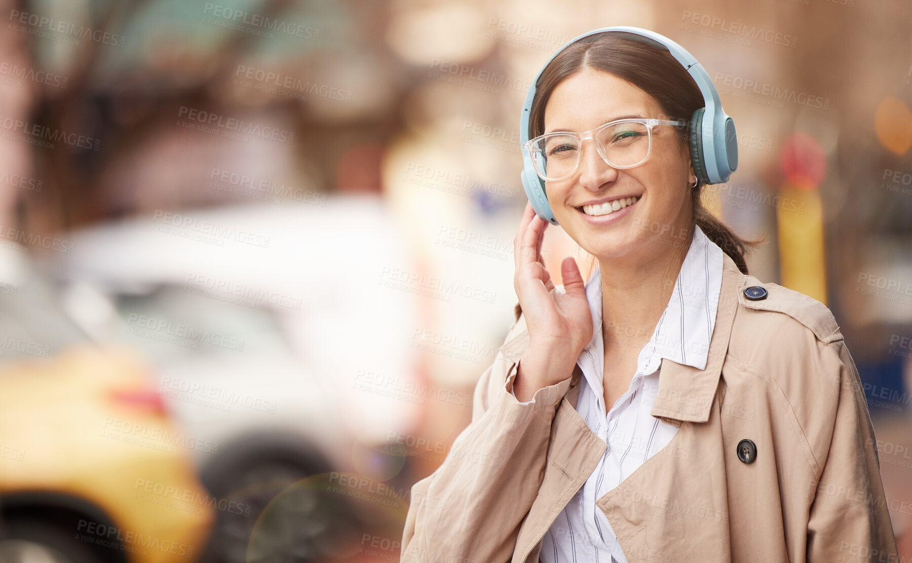 Buy stock photo Business woman, headphones and city for taxi, travel and smile with audio streaming subscription. Person, space and urban sidewalk with waiting for transportation on commute to workplace in New York