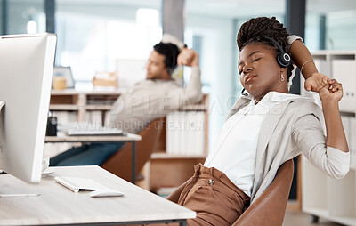 Buy stock photo Black woman, headset and tired at call centre or computer for telemarketing burnout, overtime or mental health. Female person, fatigue and arm stretching at desk, customer service or tech support