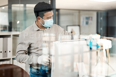Buy stock photo Office, cloth and businessman with mask in cleaning for bacteria removal, hygiene and safety at work. Company, compliance and male person with ppe by monitor for flu virus, protection and sanitation