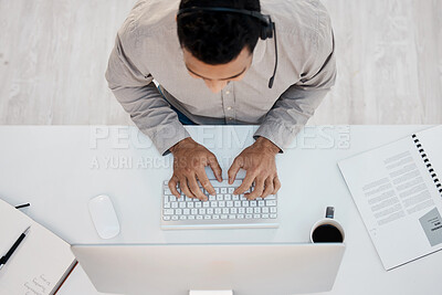 Buy stock photo Man, headset and desk at call center from above for telemarketing sales, customer support or computer. Male person, typing and contact us for agency advice with crm documents, consultant or service