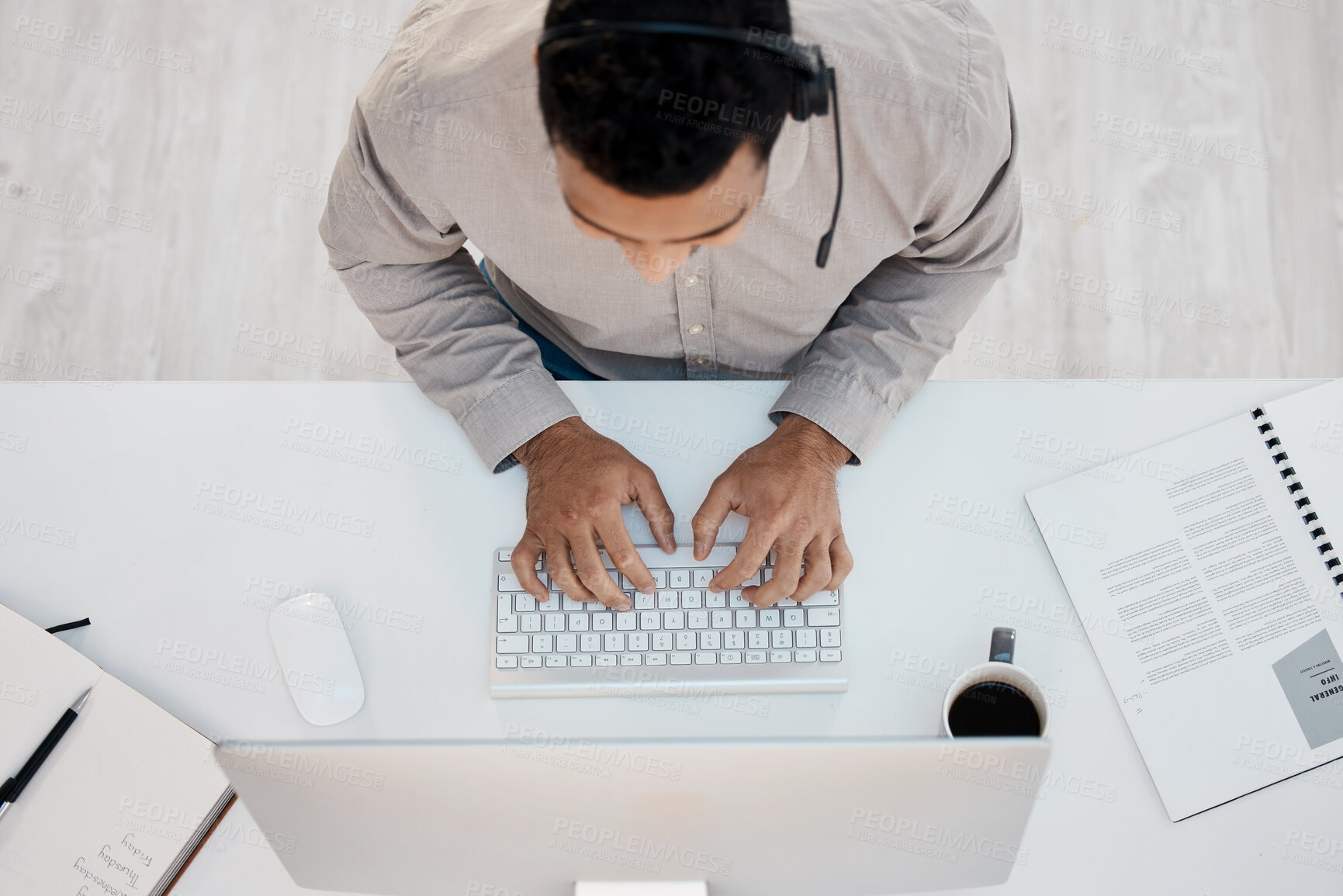 Buy stock photo Man, headset and desk at call center from above for telemarketing sales, customer support or computer. Male person, typing and contact us for agency advice with crm documents, consultant or service