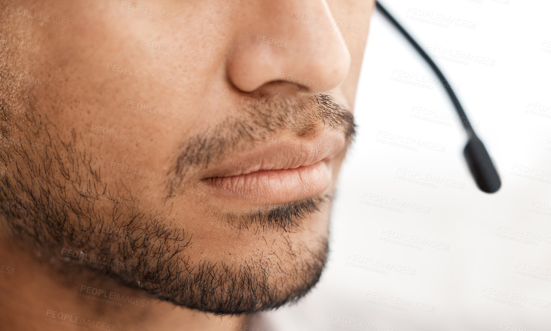 Buy stock photo Shot of a unrecognizable male working with a headset at work