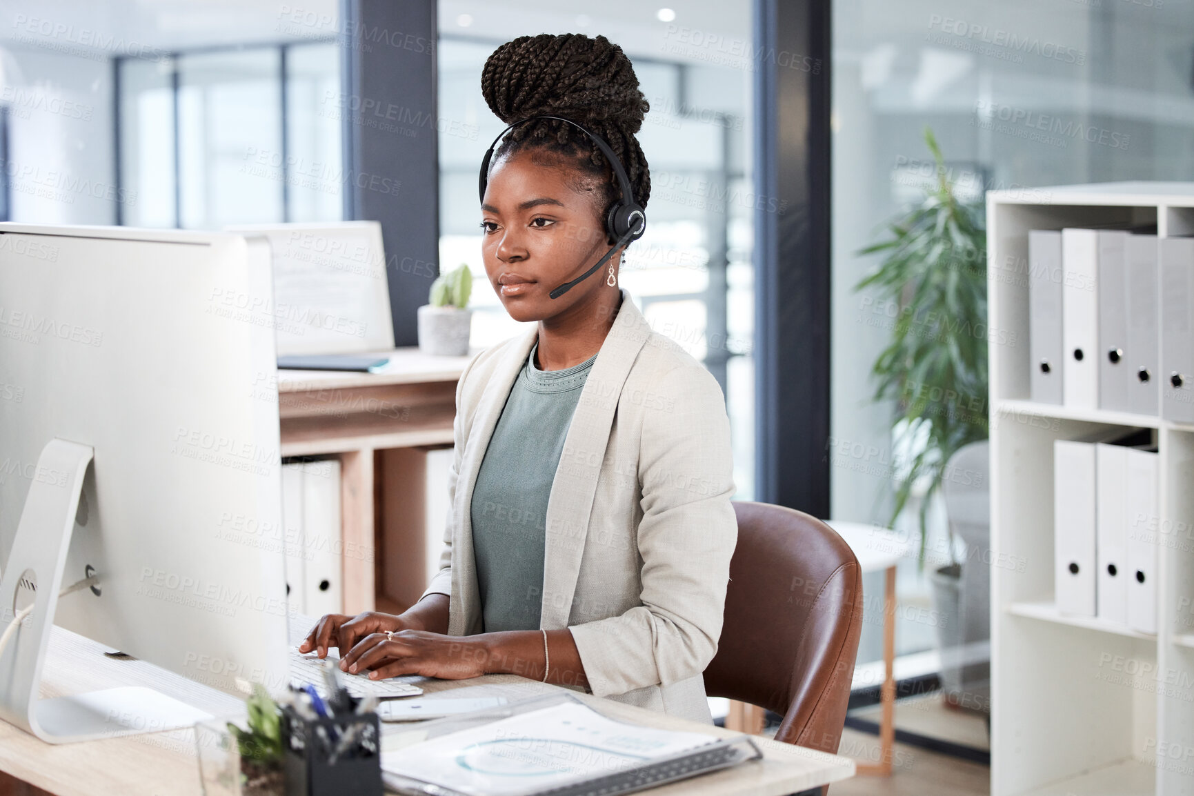 Buy stock photo Call center, computer and black woman typing for telemarketing, customer service or support. Contact us, crm or African female sales agent, consultant or person focus on business in help desk office.