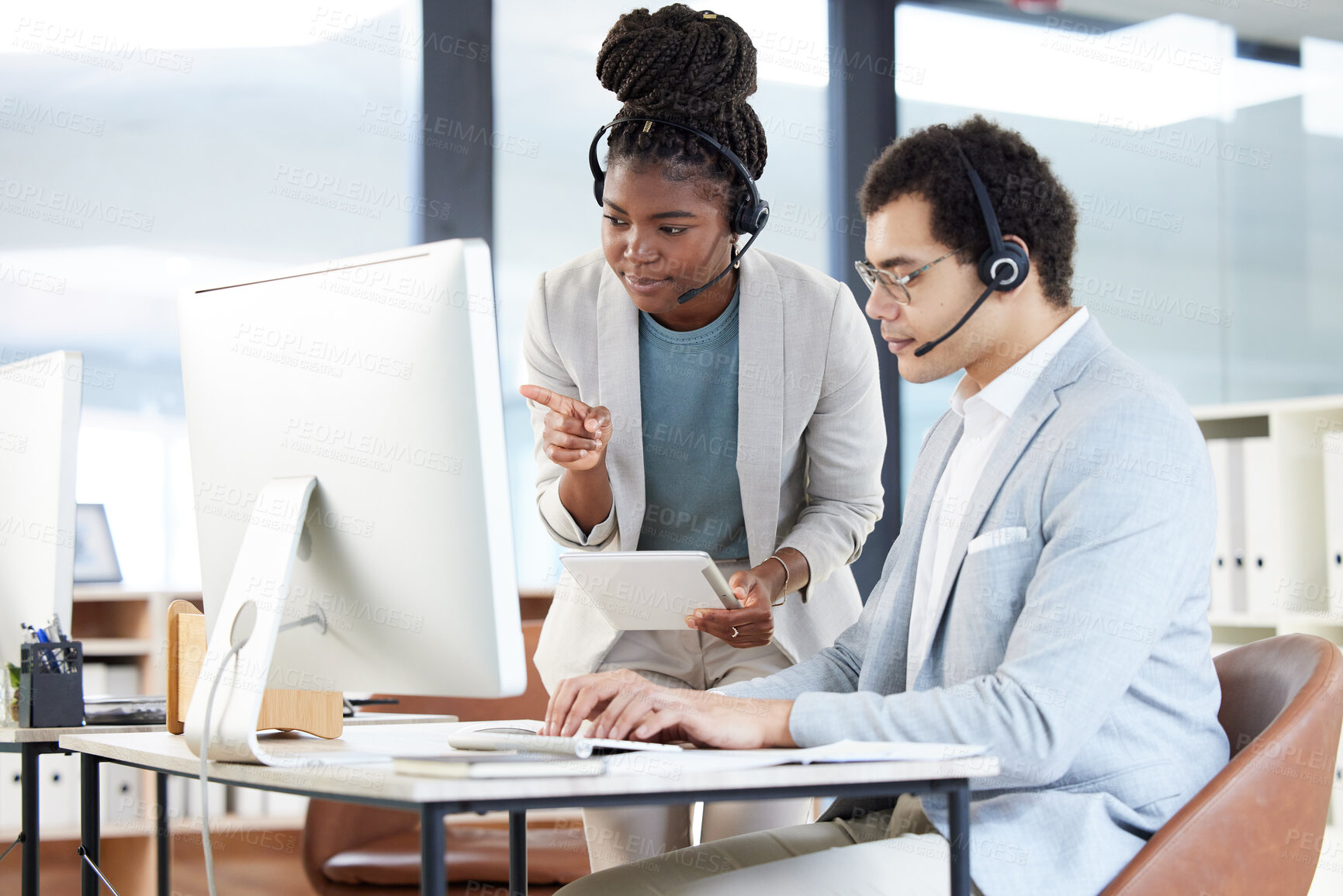 Buy stock photo Call center, coaching and black woman with employee on computer for learning customer service work. Training, tablet and man with mentor for telemarketing, teamwork or collaboration of sales agents.