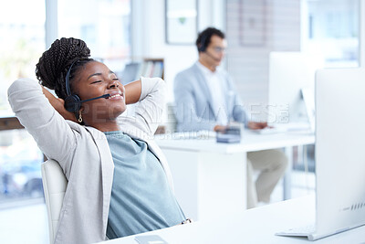 Buy stock photo Call center, woman and relax with headset and computer on desk for telemarketing or customer service. Black female on break with smile for complete, finish or productivity in crm, support or sales