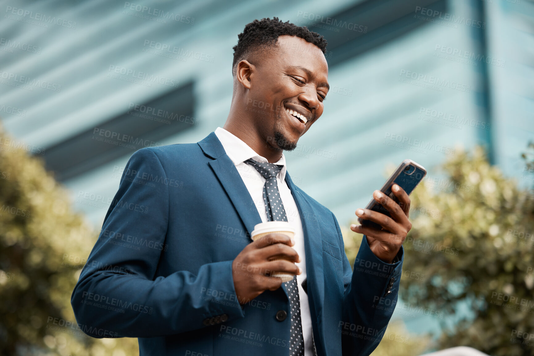 Buy stock photo Shot of a content businessman using his smartphone to send a text while in the city