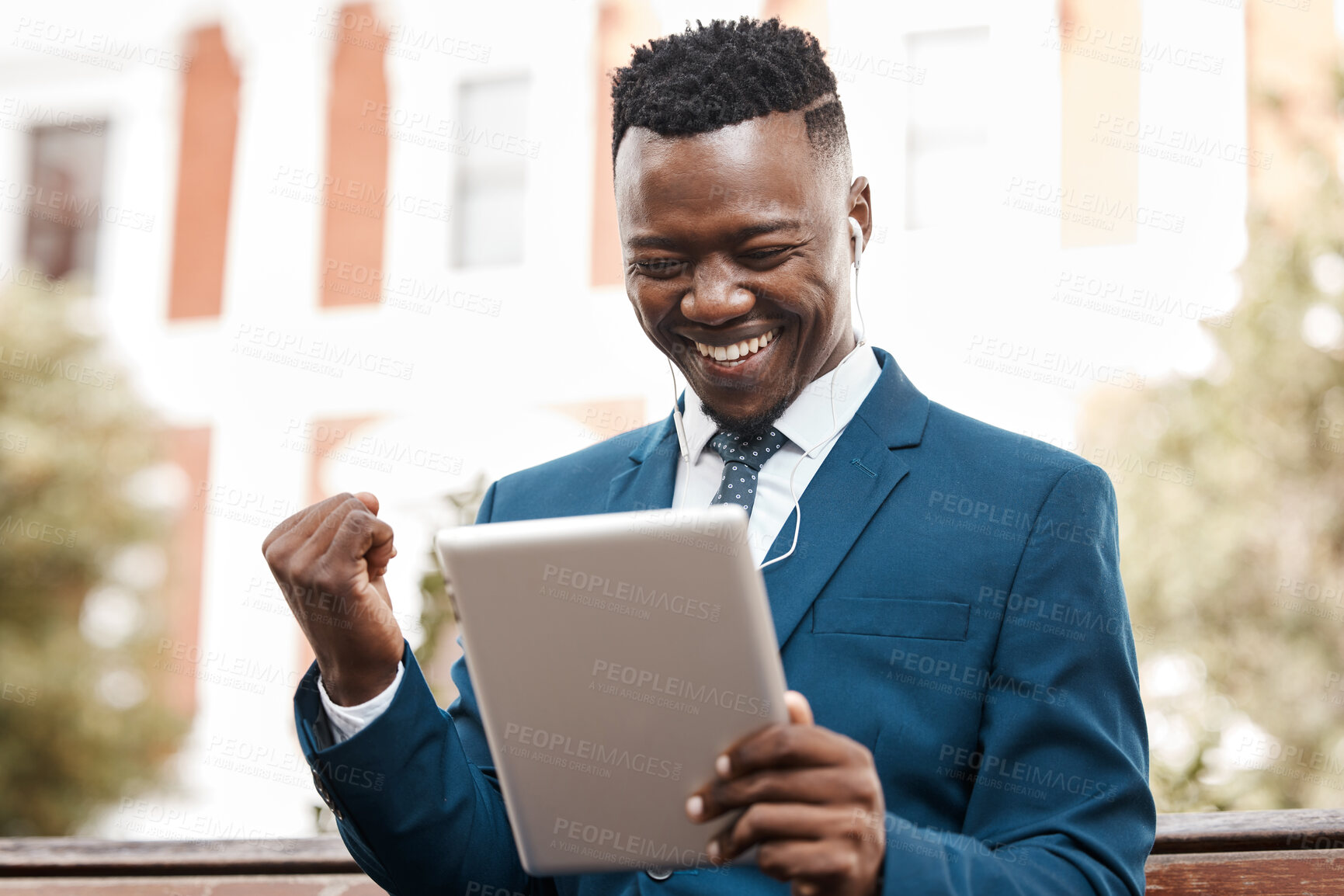 Buy stock photo Happy businessman, tablet and celebration in city for winning, promotion or good news outdoors. Black man with smile on technology for trading, profit or lottery win in success on outdoor park bench