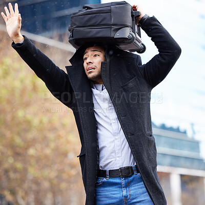 Buy stock photo Man, rain and waiting for taxi in city with luggage on head, sign and wave for driver in street. Business person, sidewalk and stop car for ride, transport or travel with storm on commute to airport