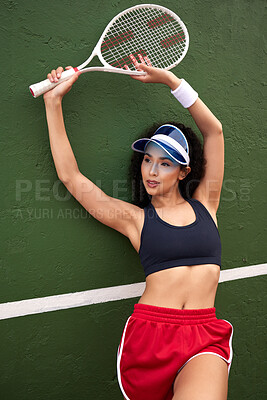 Buy stock photo Shot of a female tennis player posing with a racket