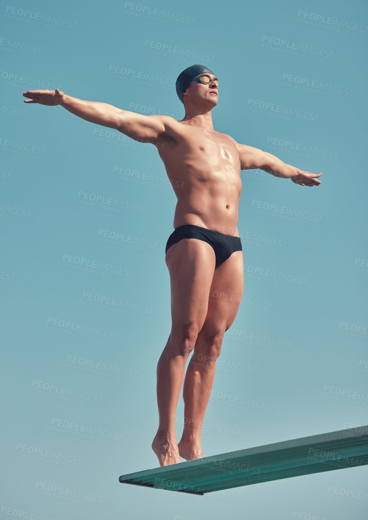 Buy stock photo Sports, ready and man with diving board for wellness, exercise and training on blue background. Stretching, fitness and athlete or swimmer person for competition, event and confident for jump