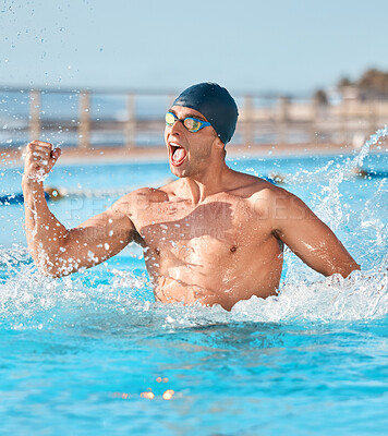 Buy stock photo Shot of a handsome young male athlete swimming in an olympic-sized pool