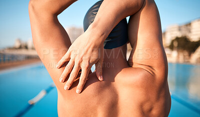 Buy stock photo Rearview shot of an unrecognizable young male athlete strecthing before his swim