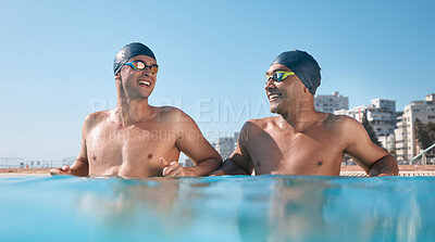Buy stock photo Shot of two young men going for a swim in an olympic pool