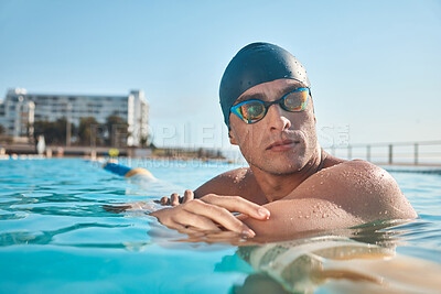 Buy stock photo Shot of a young man going for a swim in an olympic pool