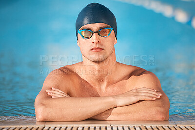 Buy stock photo Shot of a handsome young male athlete swimming in an olympic-sized pool